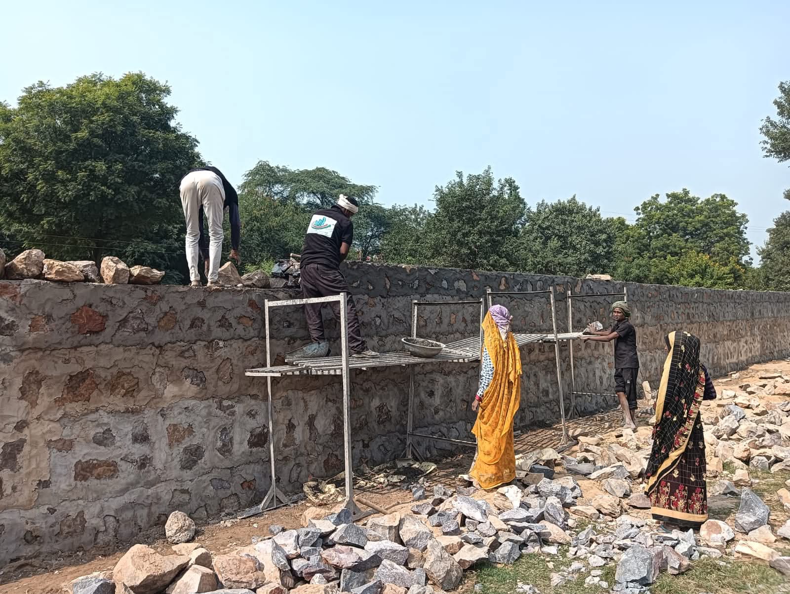 Rubble masonry compound wall construction for industrial and warehouse plots in Delhi NCR