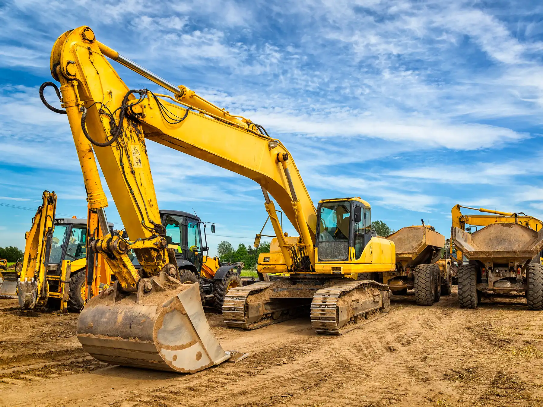 Excavator with digging bucket on rent excavating basement soil