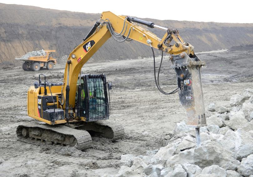 Excavator with hydraulic rock breaker attachment on rent