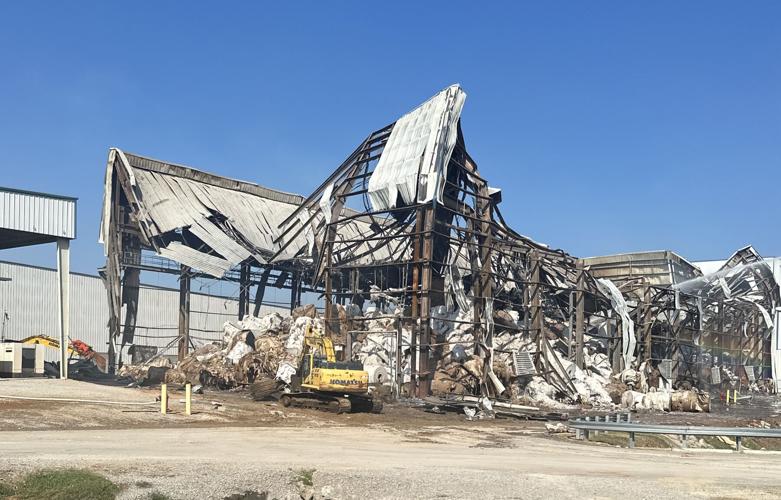 Breaking raised warehouse concrete dock wall and excavating plinth earth fill